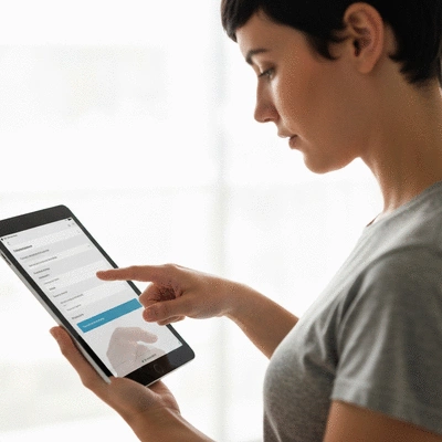 User submitting online form on tablet